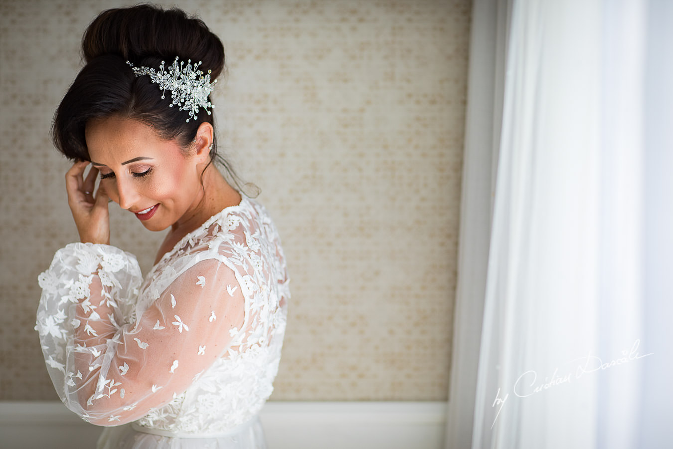 Beautiful bride posing before getting her dress, moments captured by Cristian Dascalu during an elegant Aphrodite Hills Wedding in Cyprus.