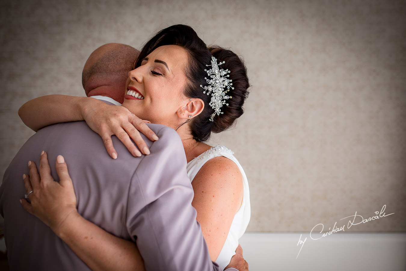 Moments when the father of the bride meets the bride, captured by Cristian Dascalu during an elegant Aphrodite Hills Wedding in Cyprus.