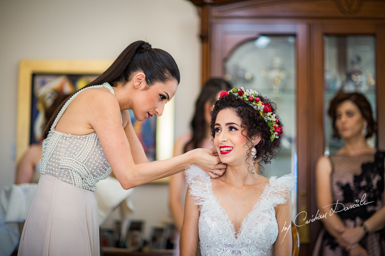 Koumera helping the bride, moments captured by Cyprus Wedding Photographer Cristian Dascalu at a beautiful wedding in Larnaka, Cyprus.