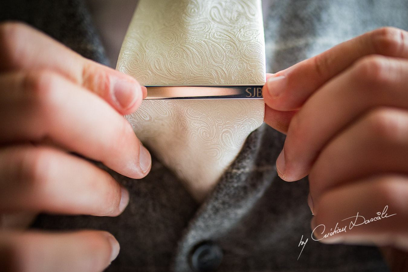 Groom's tie needle captured during an Elegant Minthis Hills Wedding, in Paphos, Cyprus.