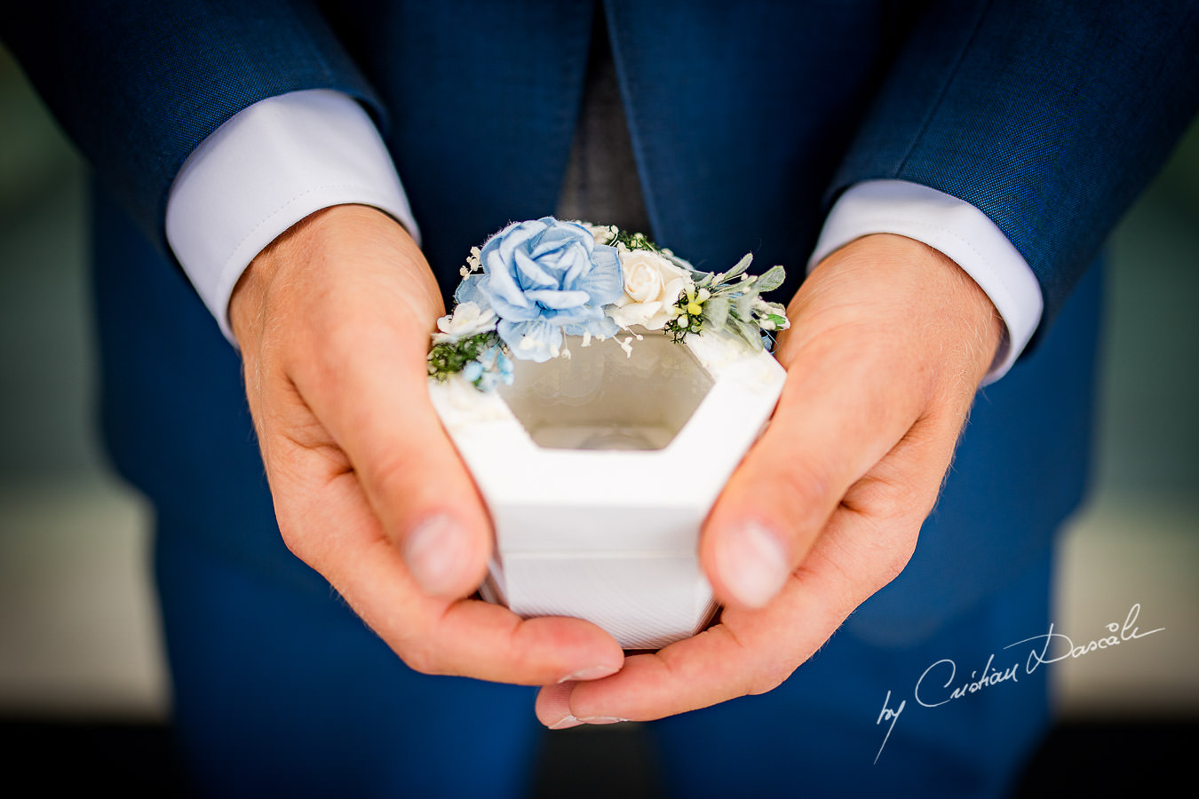 Wedding ring box carried by the best man, moments captured during an Elegant Minthis Hills Wedding, in Paphos, Cyprus.